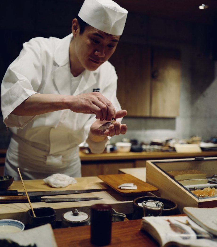 Chef Hideo Kojima making a tasty meal.